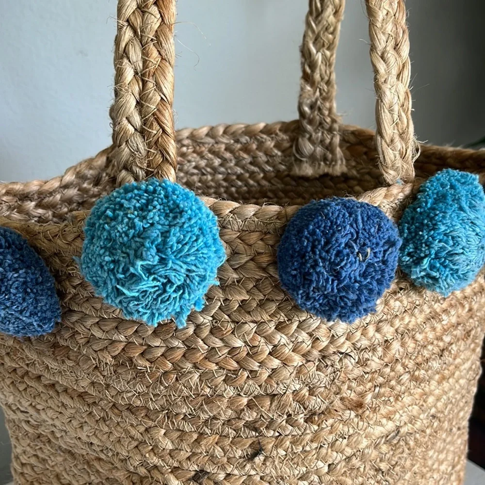 - Anthropologie Jute Braided Tote bag with  Pom Pom